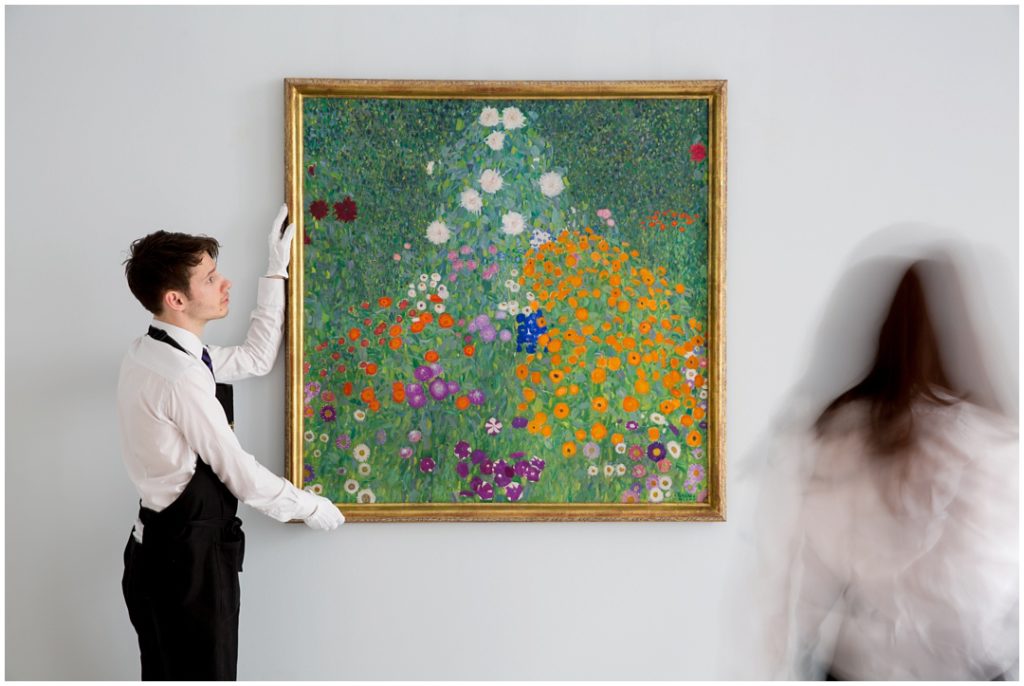 Contemporary photo for Sothebys of art handler and Klimt painting 