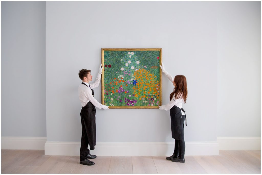 Art handlers holding painting in Mayfair, London