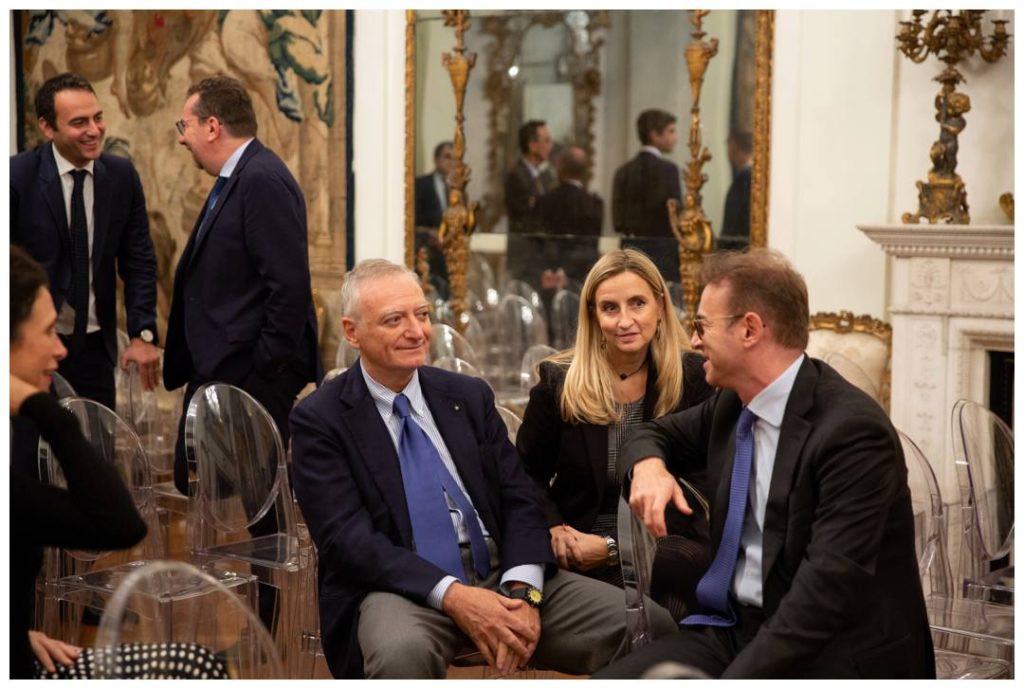 Corporate event photography of guests in the Embassy main hall chatting 