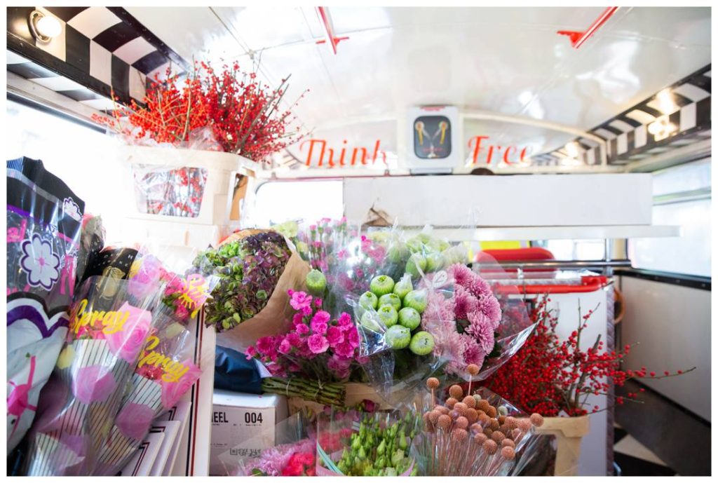 Charity Photography showing Bright flowers on the Kinder bus