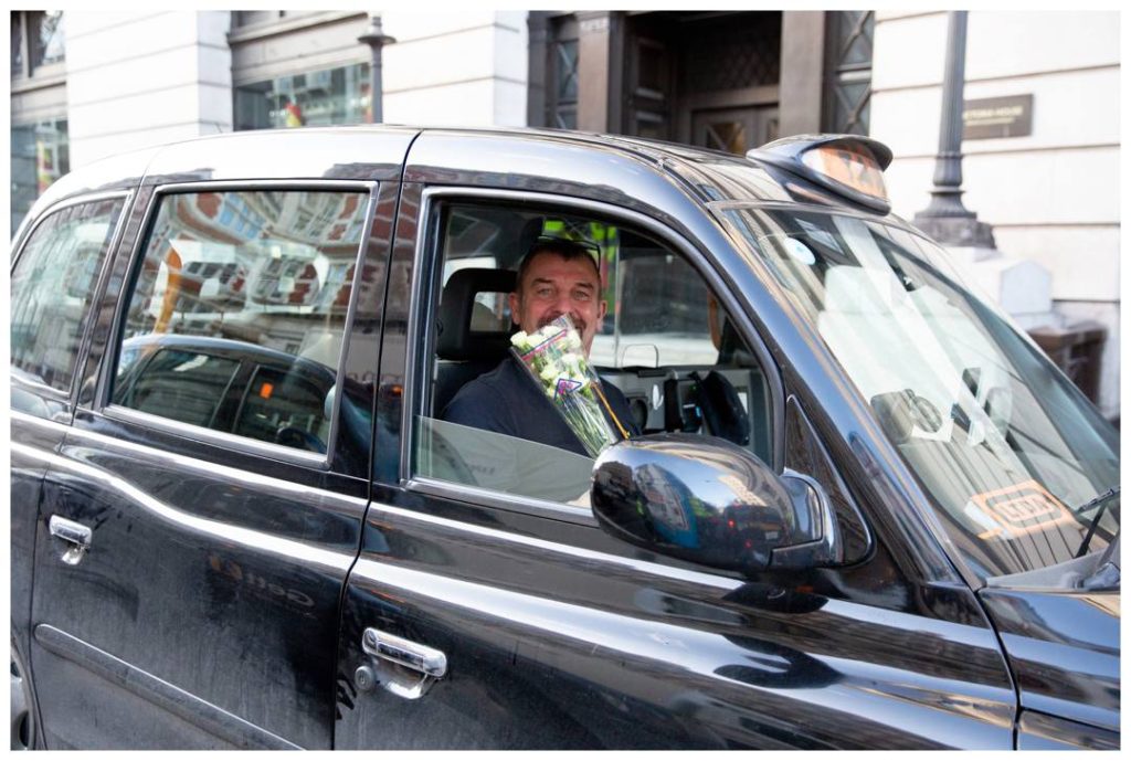 Documentary photography with London Black taxi driver and his flowers