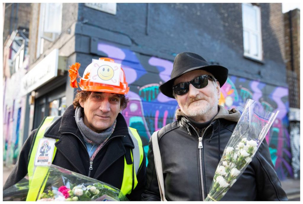 London Event Photography with volunteer and man with his flowers