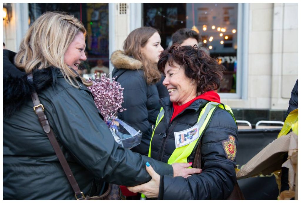 Documentary photography of Ruby Wax and recipient of flowers