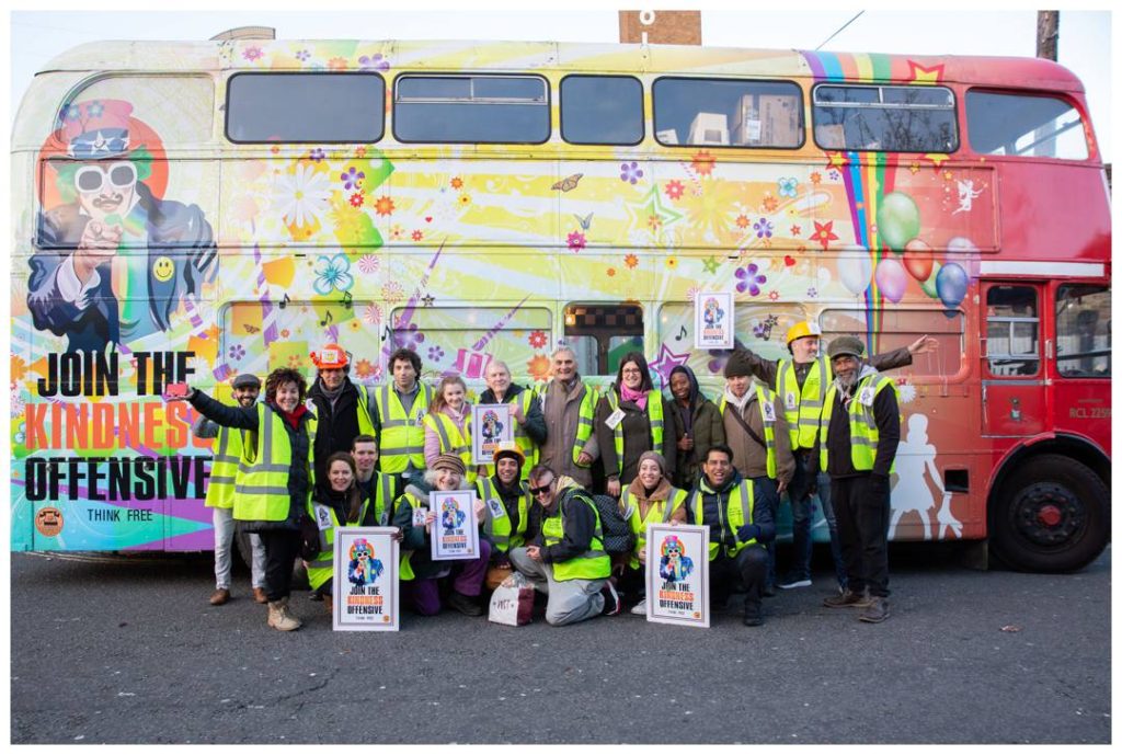 Group photo of volunteers and the Kinder bus