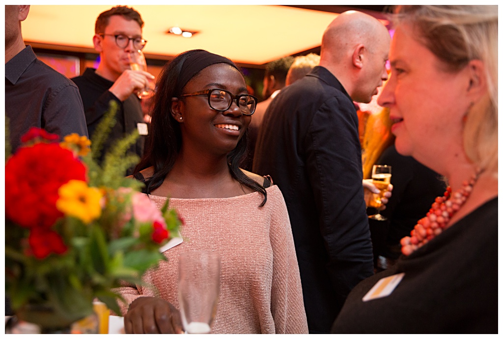 Woman smiling at Barbican drinks reception event