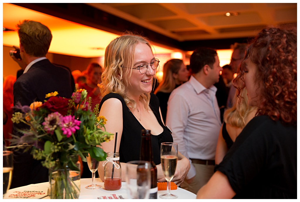 Female guest laughing at Barbican event