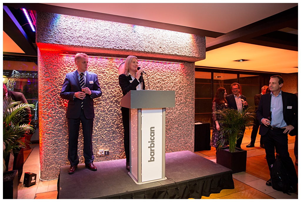 A speech being given by two hosts at Barbican exhibition launch