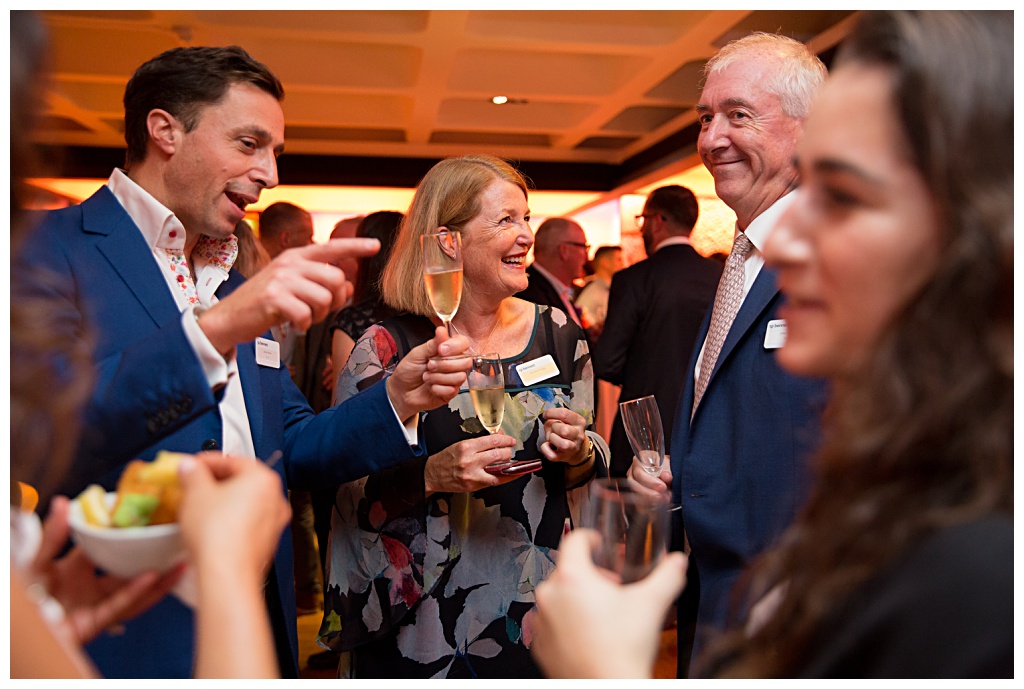 Barbican events photography of Guests chatting, laughing, drinking and eating