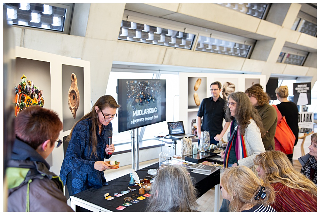 Tate modern exhibit visitors looking at artefacts