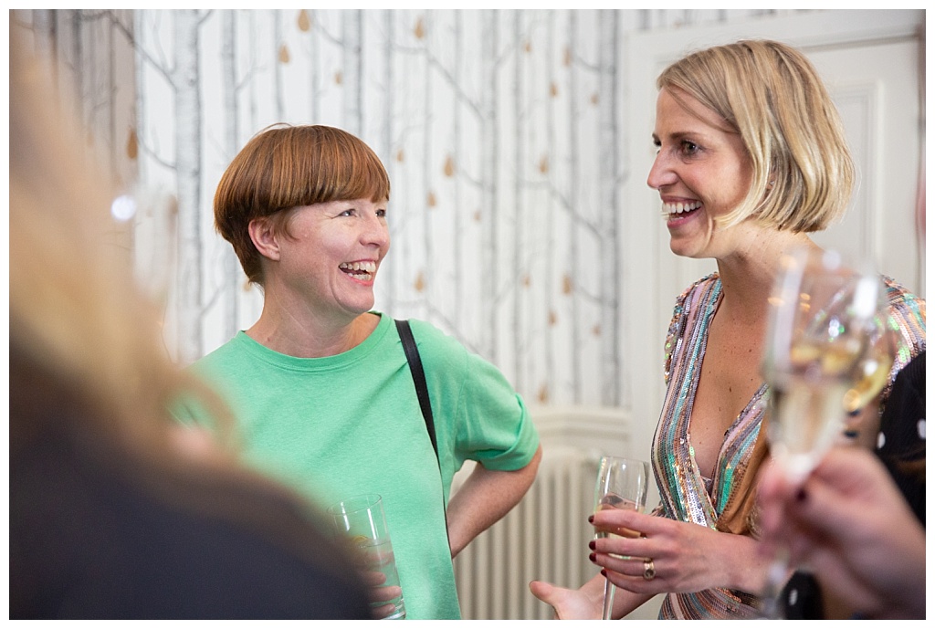 Women laughing at The House of St Barnabas Soho