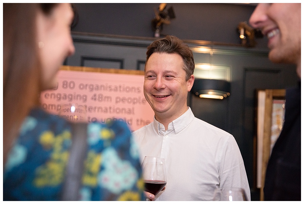 Man laughing at party